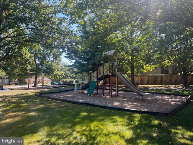 a view of a house with swimming pool and sitting area