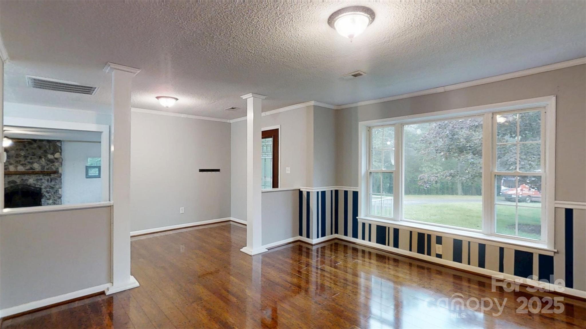 3151 Lynn Mountain Road Vale, NC 28168 - Photo 6 of 38 a view of an empty room with wooden floor and a window
