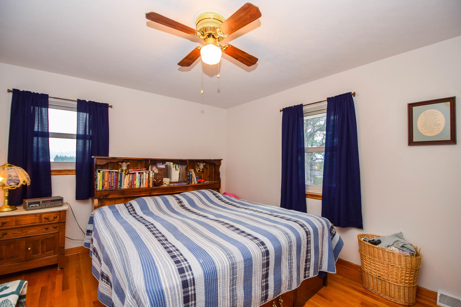 544 Olney Road Vinton, VA 24179 - Photo 11 of 23 a bedroom with a bed and a chandelier