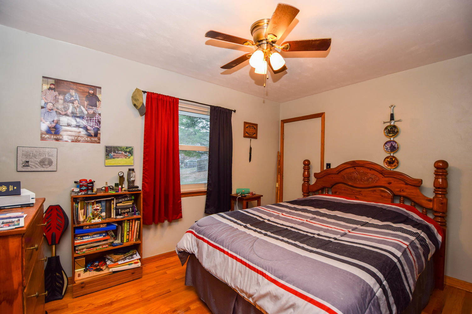 544 Olney Road Vinton, VA 24179 - Photo 9 of 23 a bedroom with a bed and a chandelier