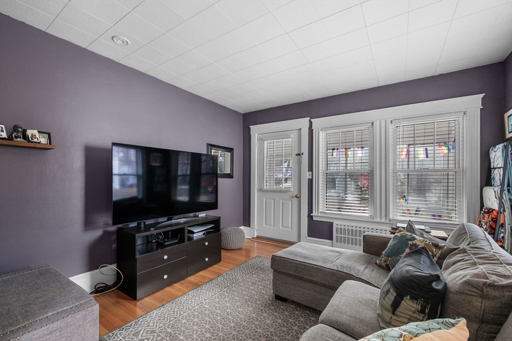 34 Moffatt Road, Unit 34 Salem, MA 01970 - Photo 11 of 23 a living room with furniture and a flat screen tv
