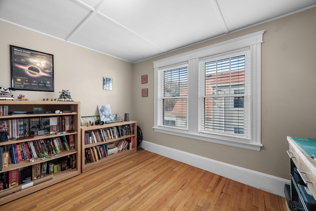 34 Moffatt Road, Unit 34 Salem, MA 01970 - Photo 18 of 23 a view of room with furniture book shelf and wooden floor