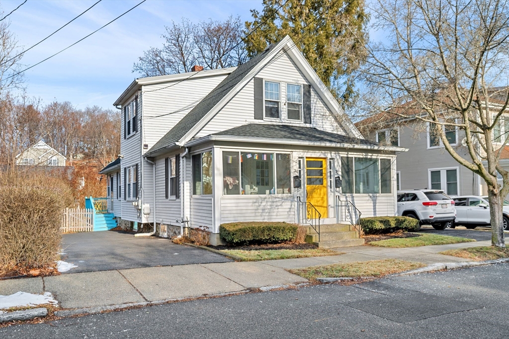 34 Moffatt Road, Unit 34 Salem, MA 01970 - Photo 2 of 23 a front view of a house with a yard