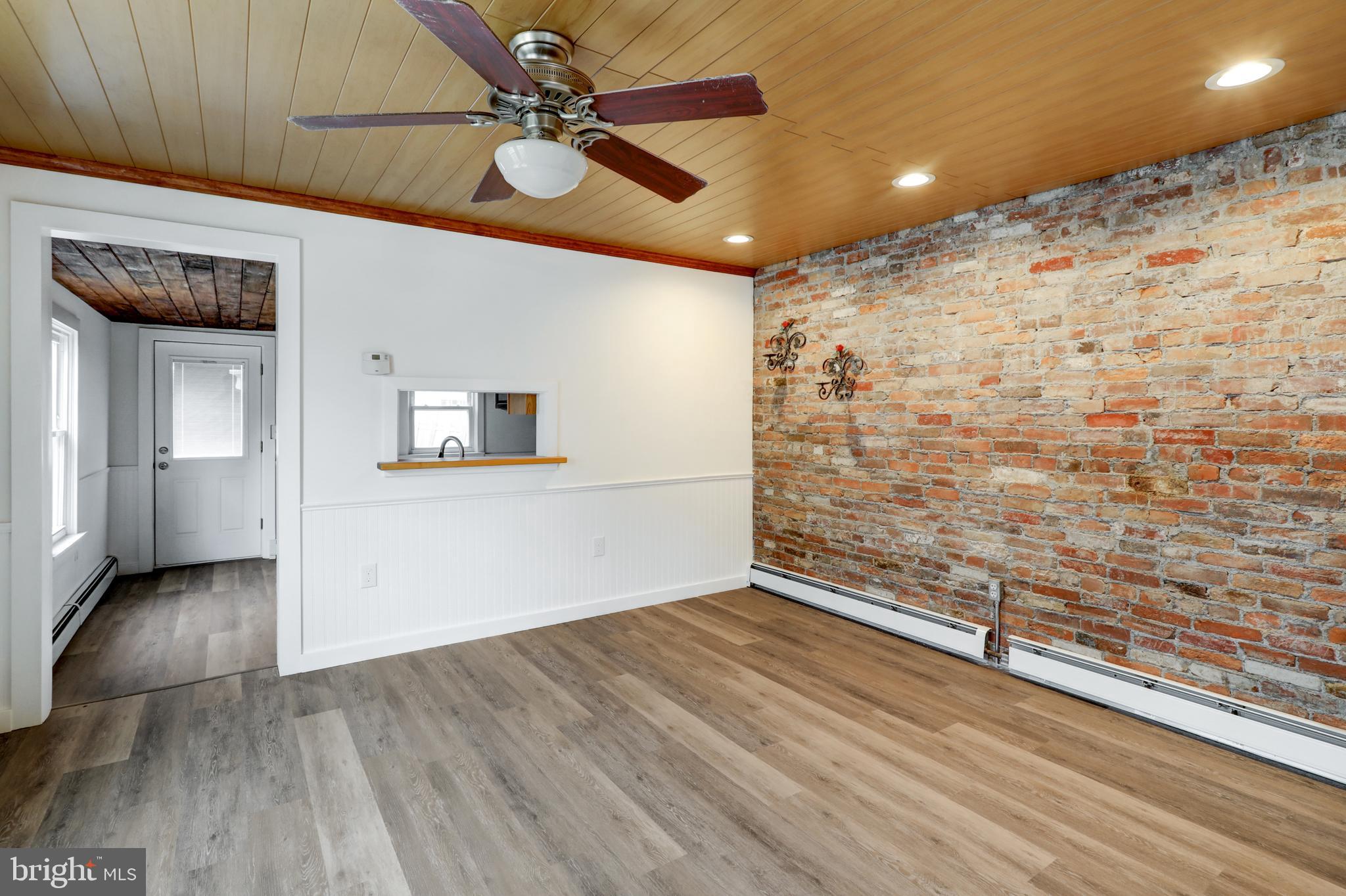 157 South Wolf Street Manheim, PA 17545 - Photo 11 of 23 a view of a livingroom with wooden floor and a ceiling fan