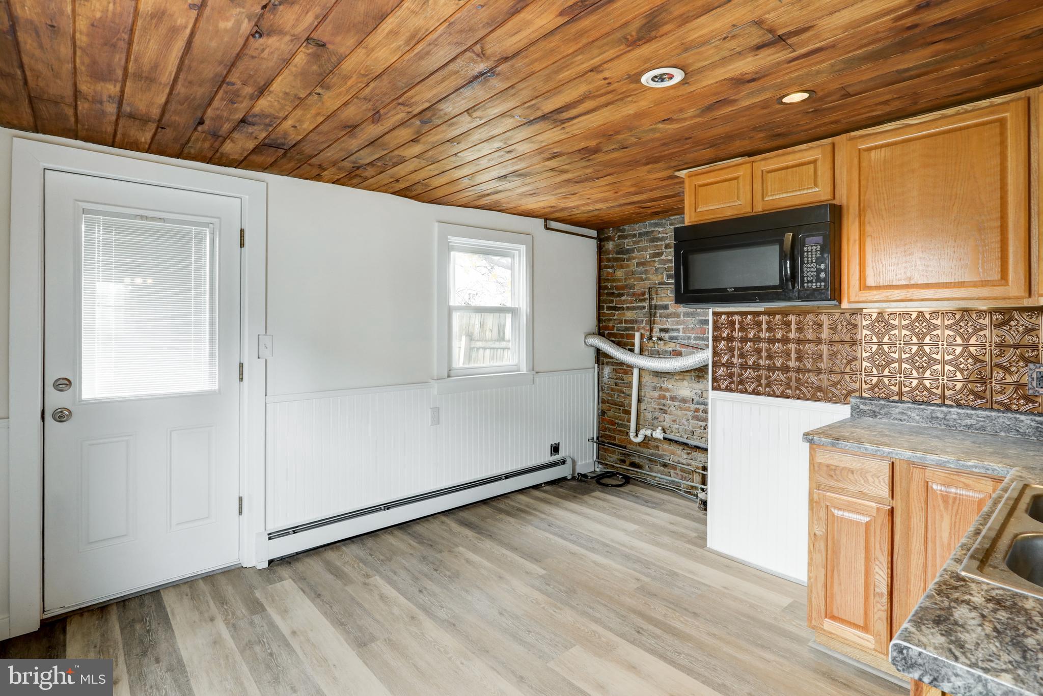 157 South Wolf Street Manheim, PA 17545 - Photo 13 of 23 a view of kitchen with furniture and flat screen tv