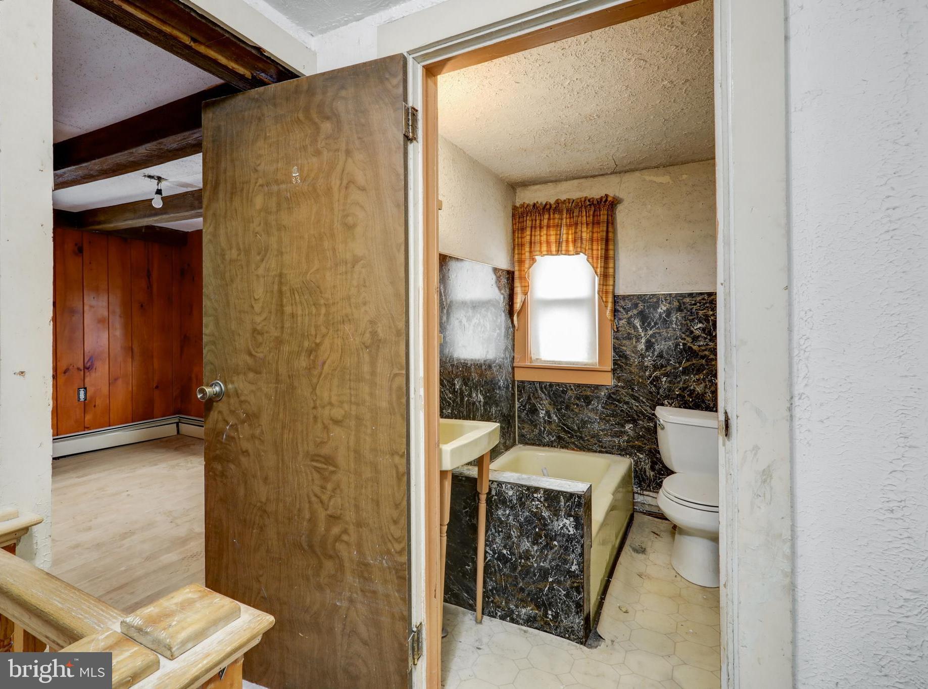 157 South Wolf Street Manheim, PA 17545 - Photo 17 of 23 a bathroom with a toilet a sink and shower