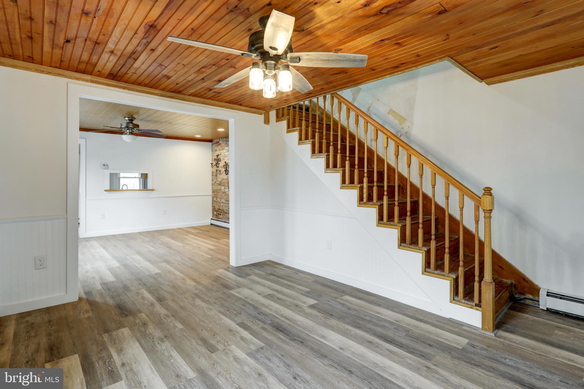 157 South Wolf Street Manheim, PA 17545 - Photo 8 of 23 a view of a hallway with wooden floor and staircase