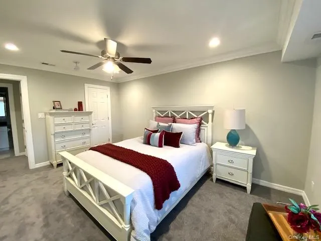 a bedroom with a bed and a cabinets