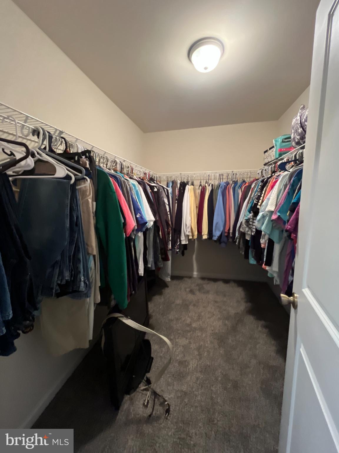 13046 Monterey Lane Blue Ridge Summit, PA 17214 - Photo 23 of 32 Spacious closet with organized clothing racks.