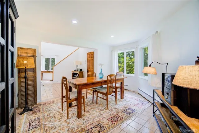 a dining room with furniture and window