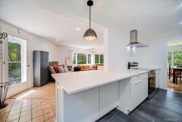 a kitchen with a refrigerator and a sink