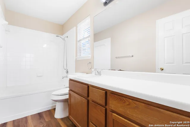 a bathroom with a sink a toilet and a bathtub