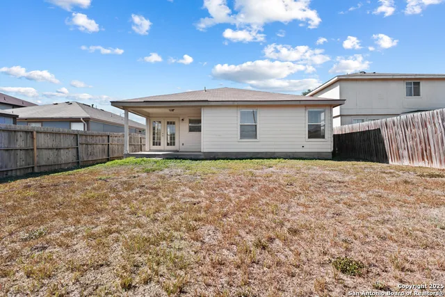 a house view with a backyard space