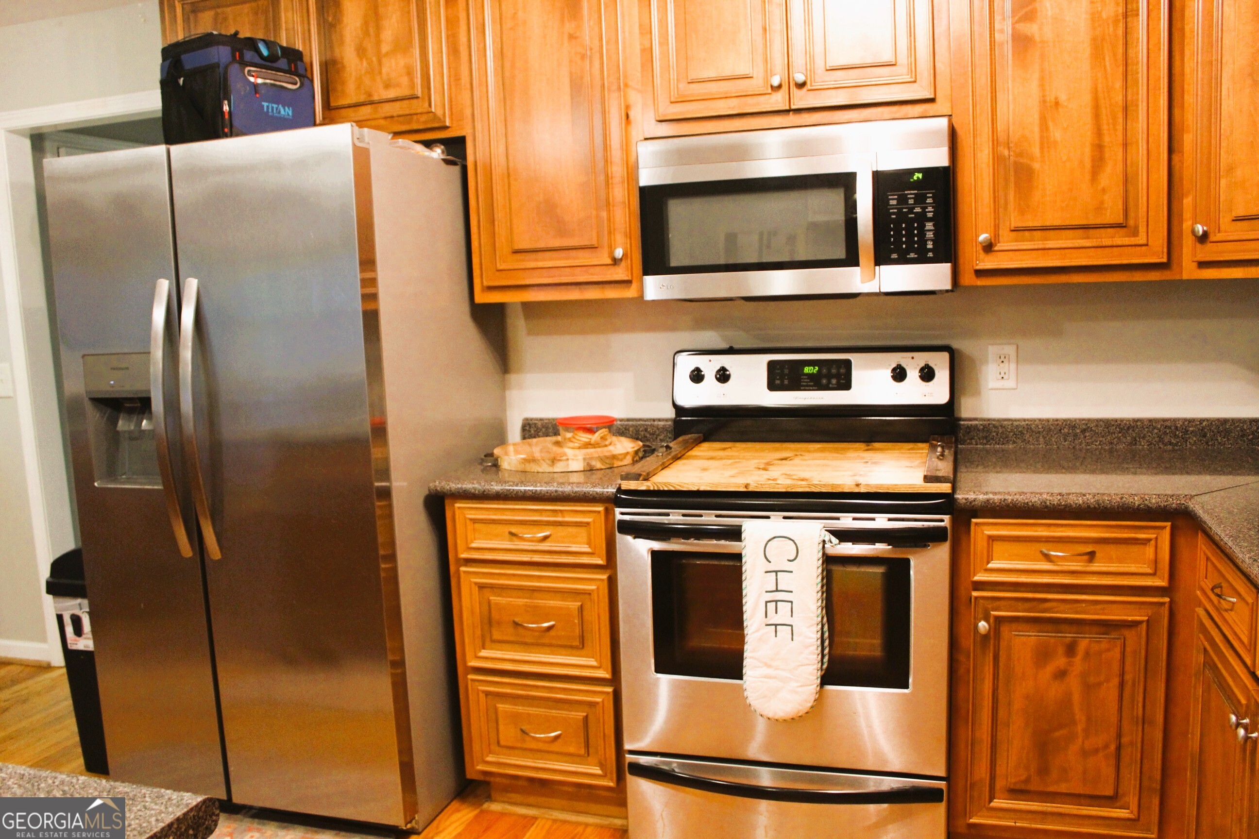 2796 Barbon Road Monroe, GA 30656 - Photo 16 of 36 a kitchen with stainless steel appliances granite countertop a refrigerator and a stove