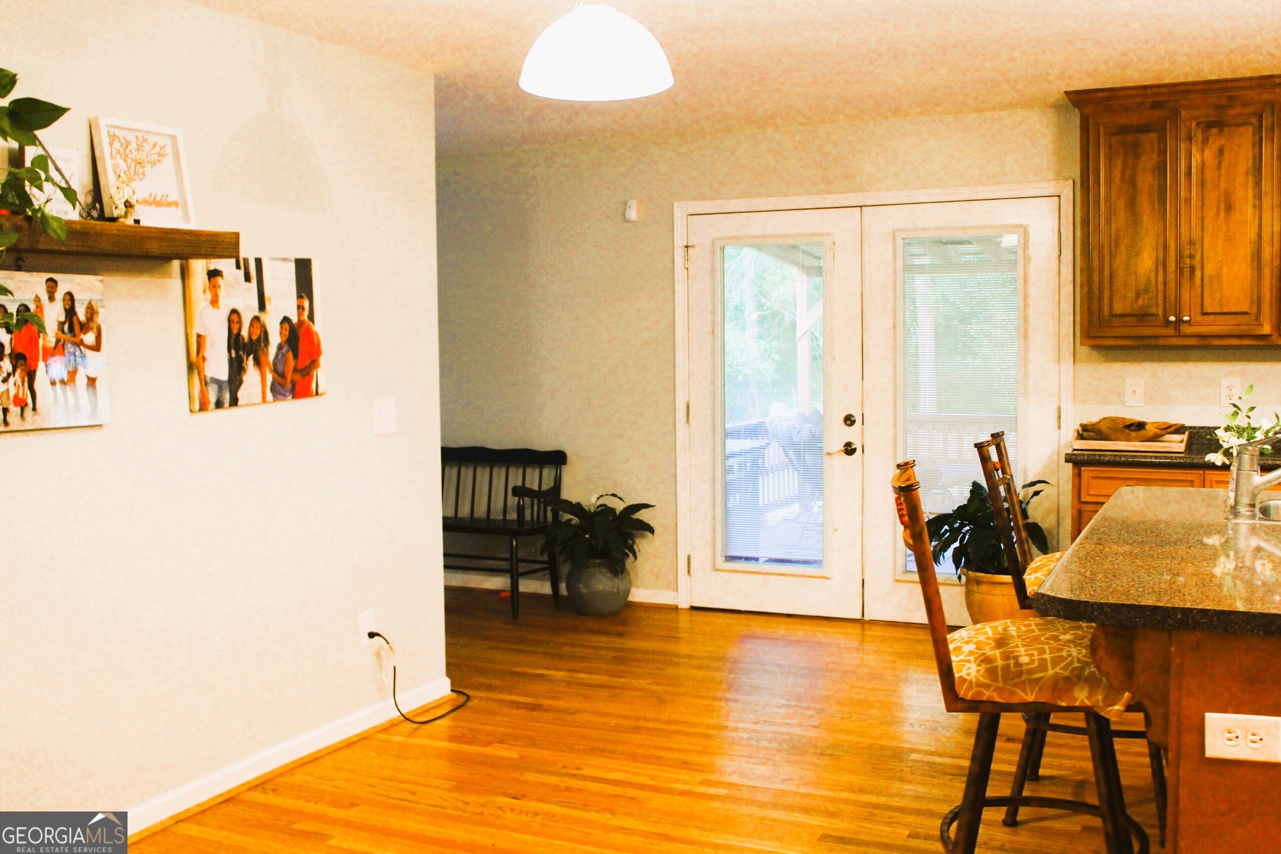 2796 Barbon Road Monroe, GA 30656 - Photo 17 of 36 a view of a livingroom with furniture a dinning room and floor to ceiling window