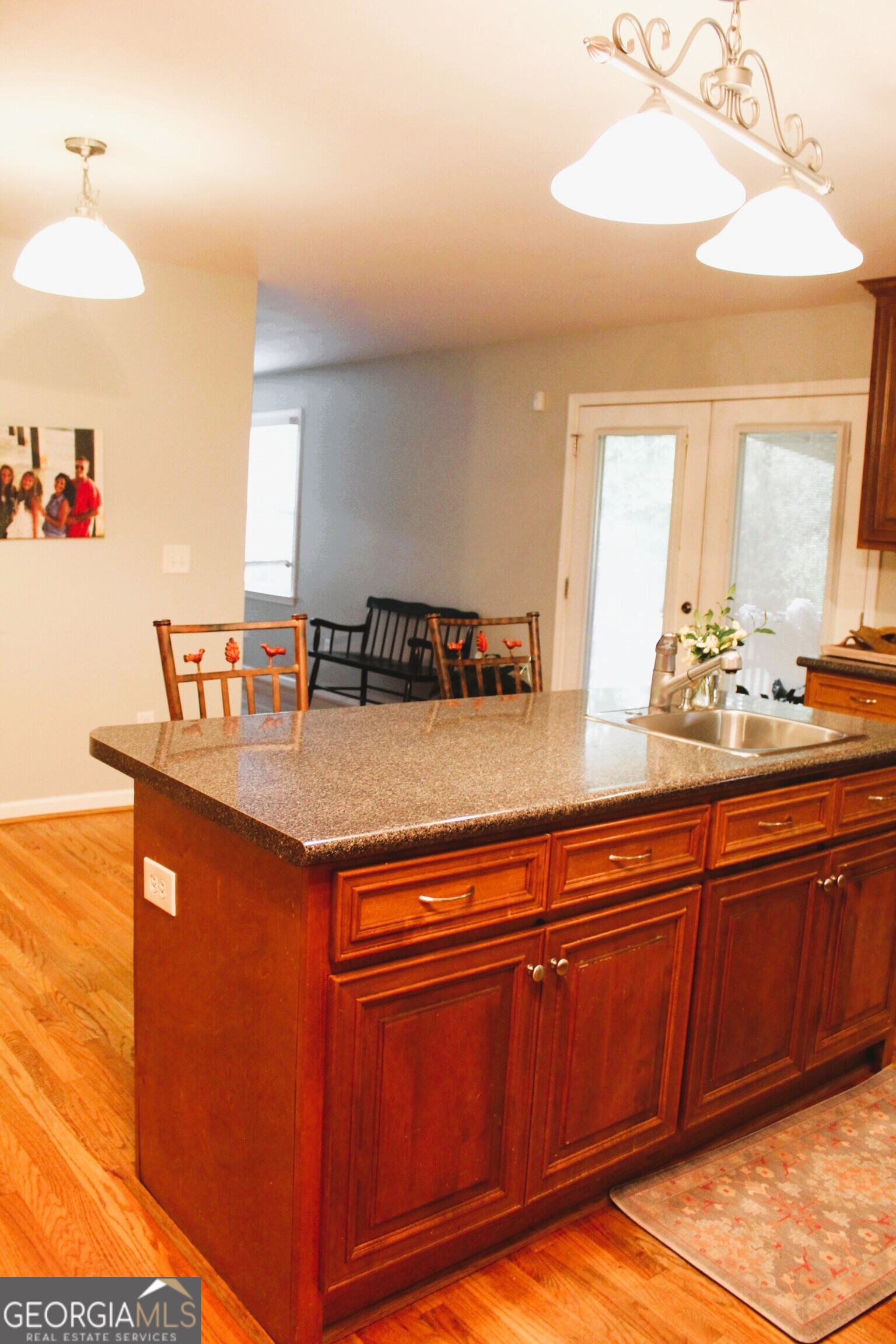 2796 Barbon Road Monroe, GA 30656 - Photo 19 of 36 a kitchen with granite countertop a sink cabinets and window