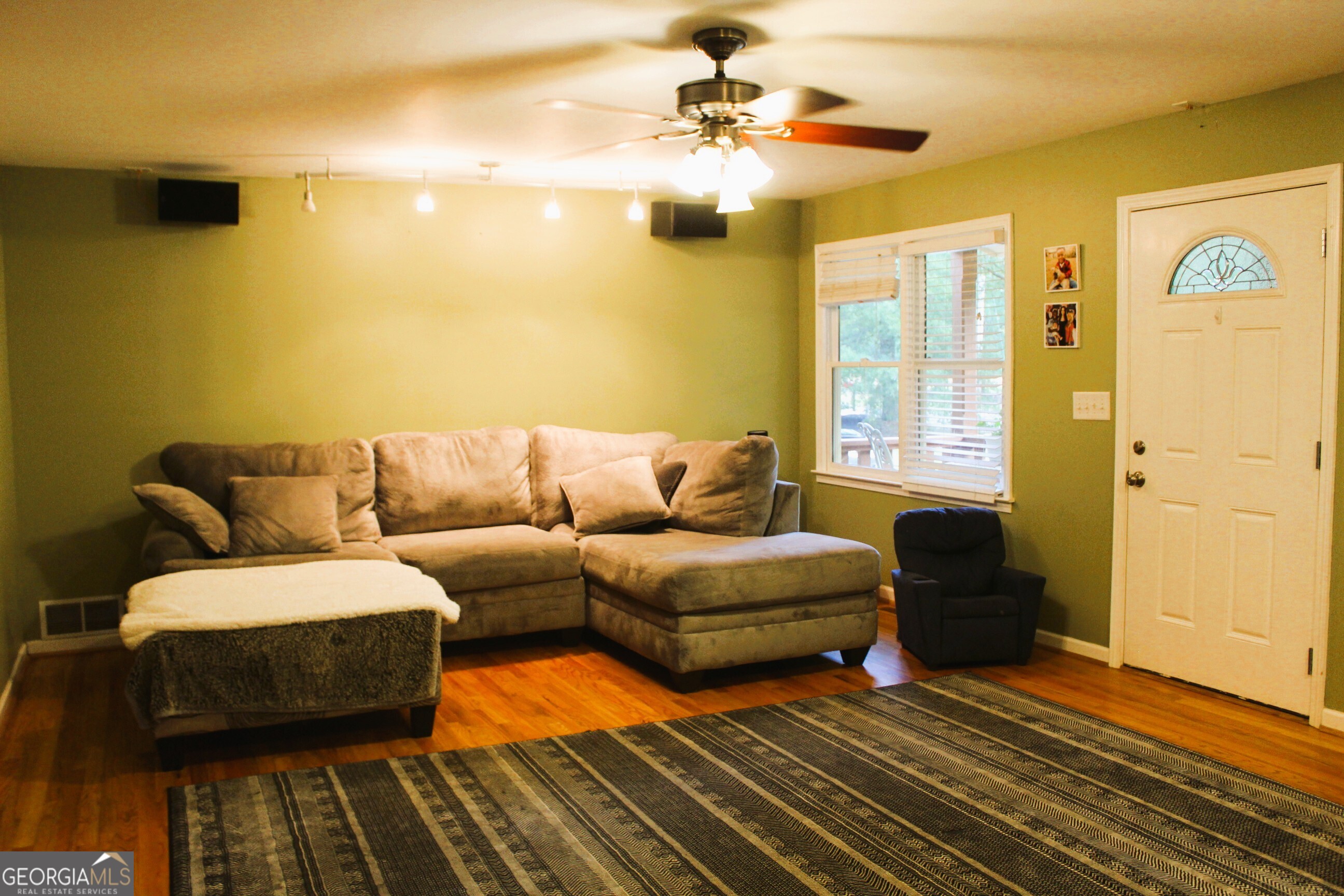 2796 Barbon Road Monroe, GA 30656 - Photo 23 of 36 a living room with furniture and a rug