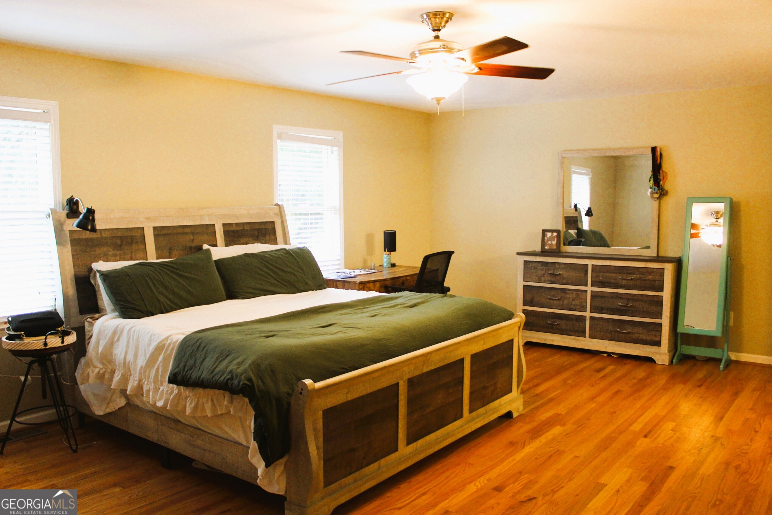 2796 Barbon Road Monroe, GA 30656 - Photo 28 of 36 a bed room with a bed and a ceiling fan