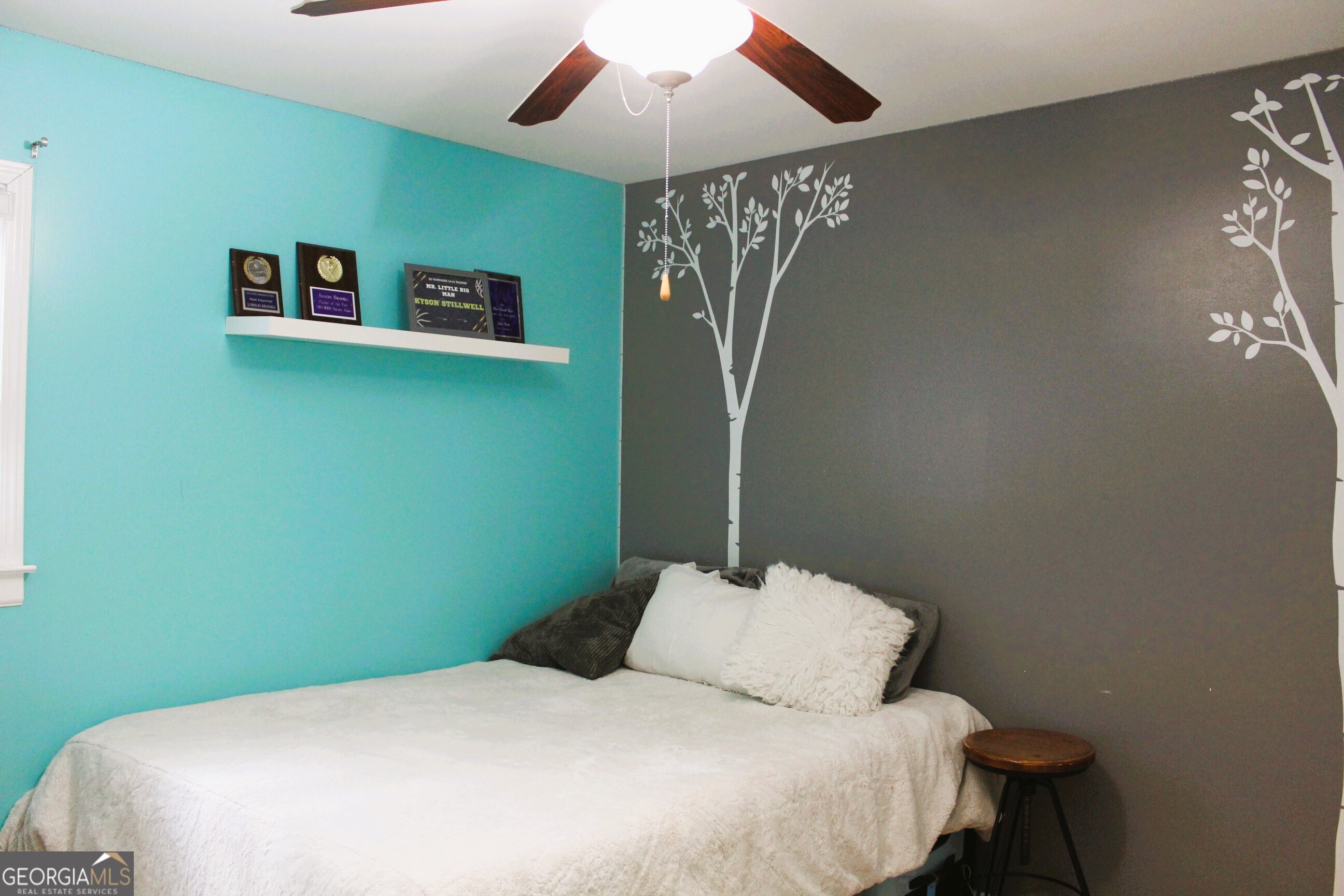 2796 Barbon Road Monroe, GA 30656 - Photo 32 of 36 a bedroom with a bed and a chandelier