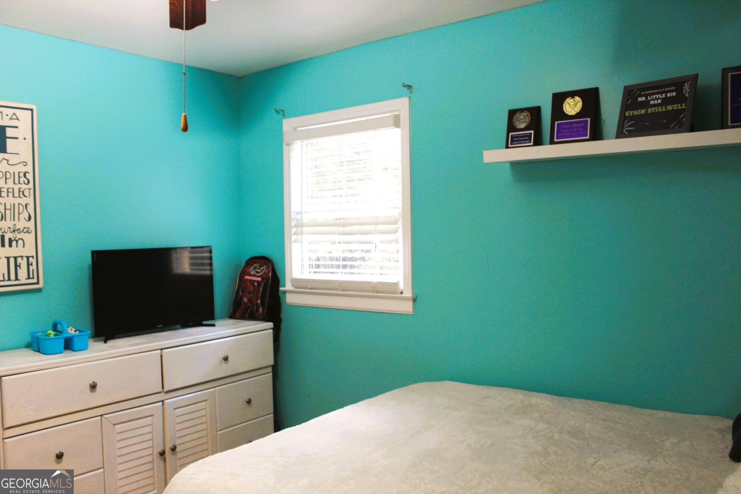 2796 Barbon Road Monroe, GA 30656 - Photo 33 of 36 a bedroom with window and cabinet