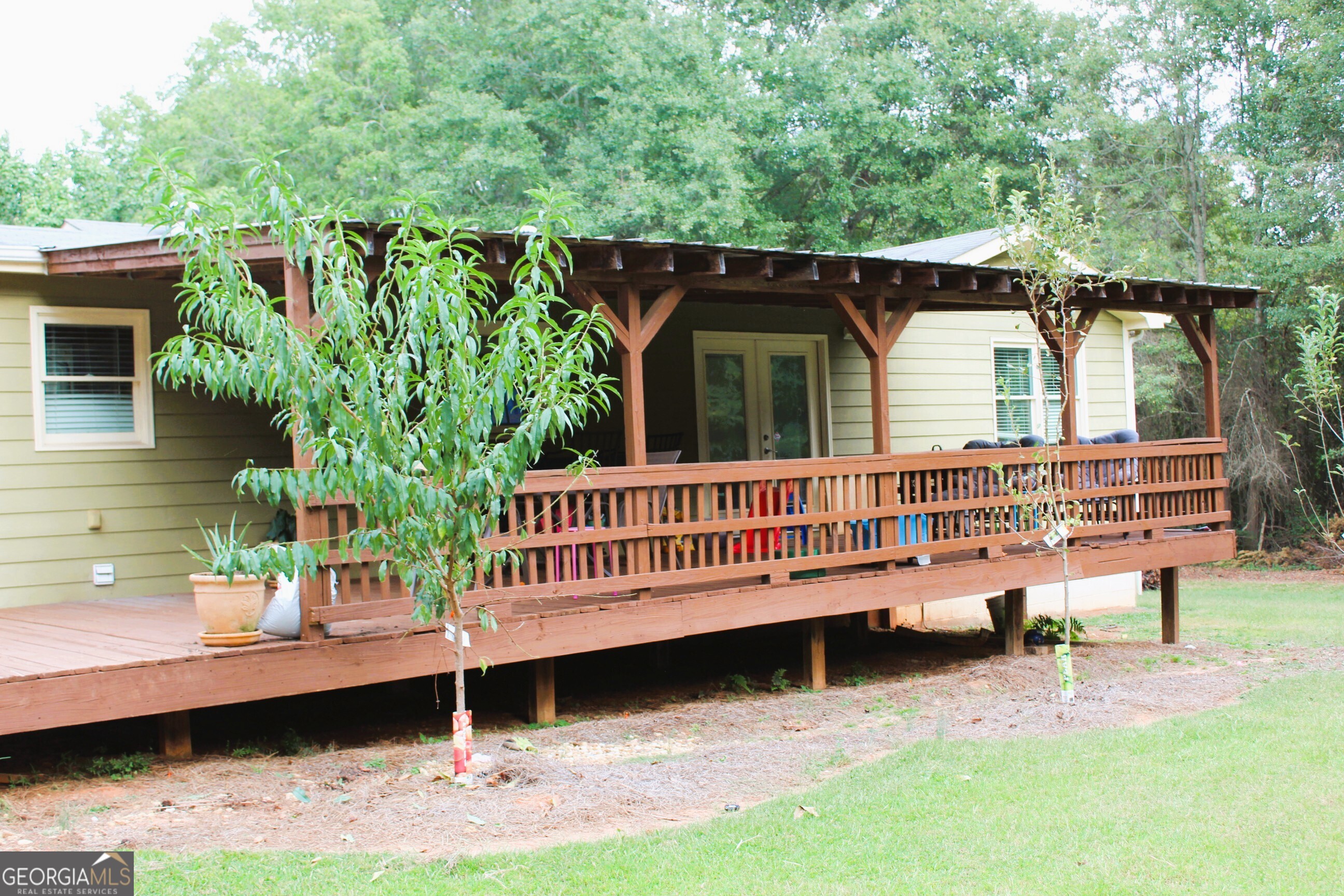 2796 Barbon Road Monroe, GA 30656 - Photo 4 of 36 a small pool with a bench in the patio