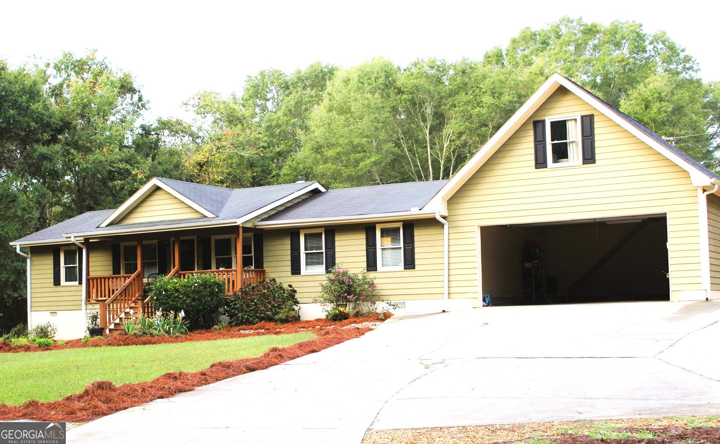 2796 Barbon Road Monroe, GA 30656 - Photo 9 of 36 a front view of a house with a yard