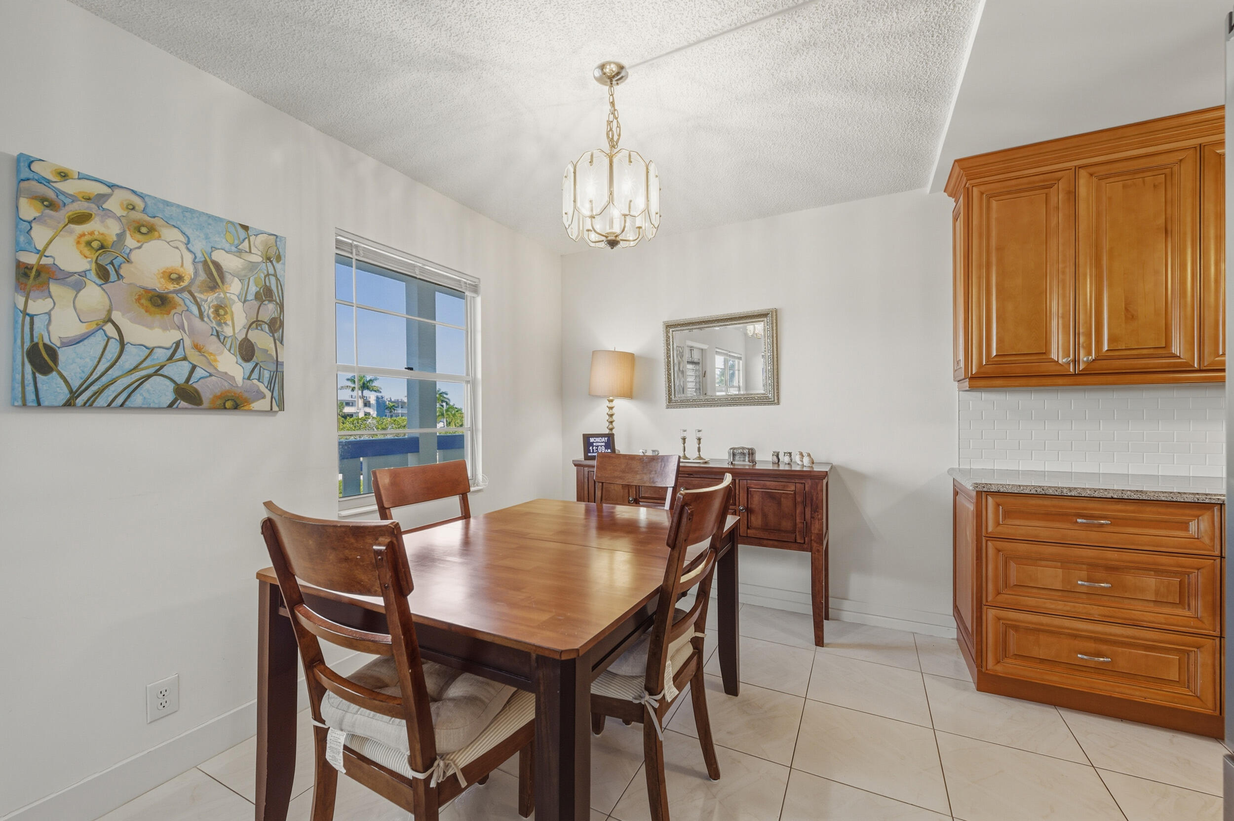 3063 Yarmouth C Boca Raton, FL 33434 - Photo 16 of 40 a view of a dining room with furniture