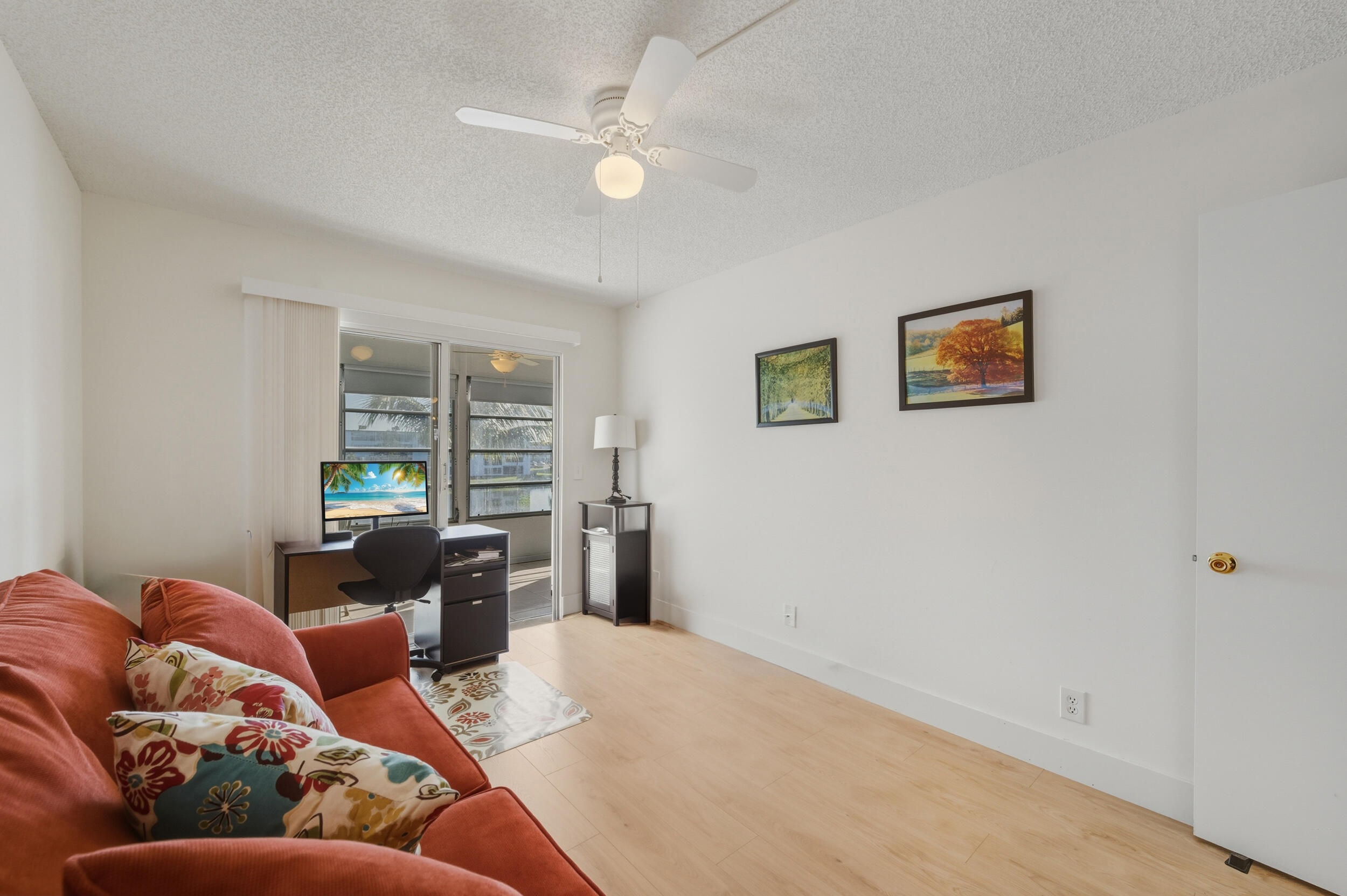 3063 Yarmouth C Boca Raton, FL 33434 - Photo 29 of 40 a living room with furniture and a large window