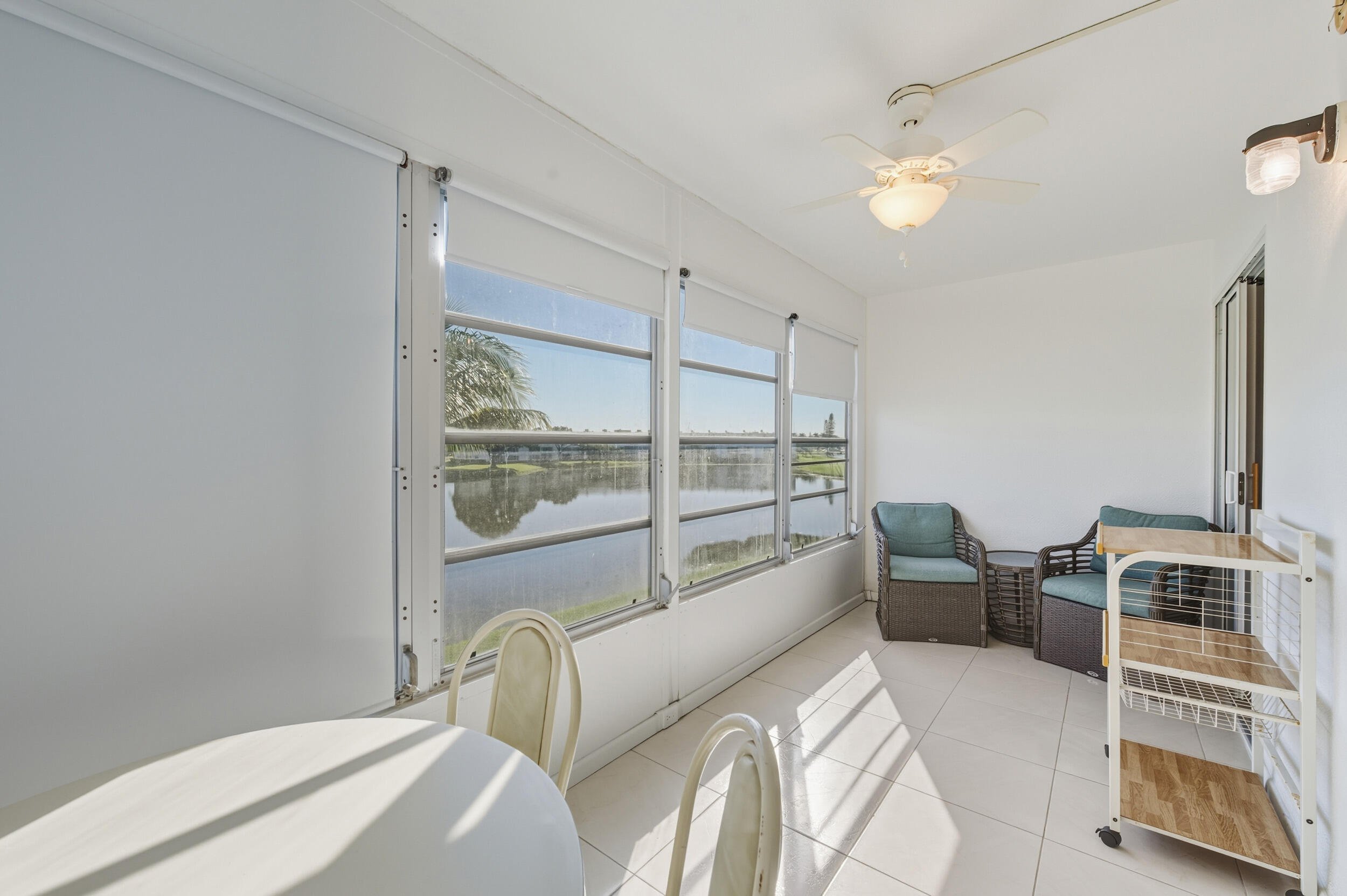 3063 Yarmouth C Boca Raton, FL 33434 - Photo 31 of 40 a bedroom with furniture and a window