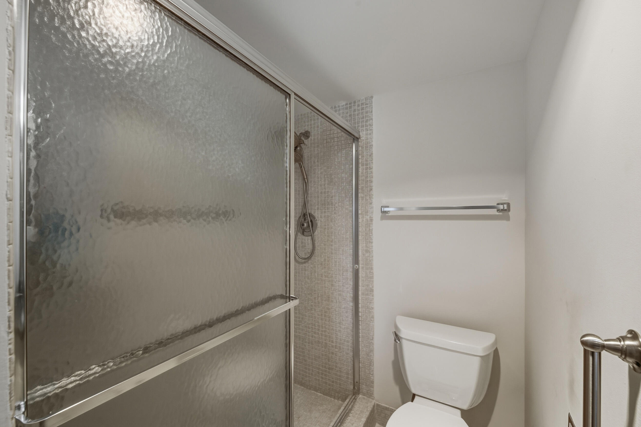3063 Yarmouth C Boca Raton, FL 33434 - Photo 39 of 40 a bathroom with a shower and toilet