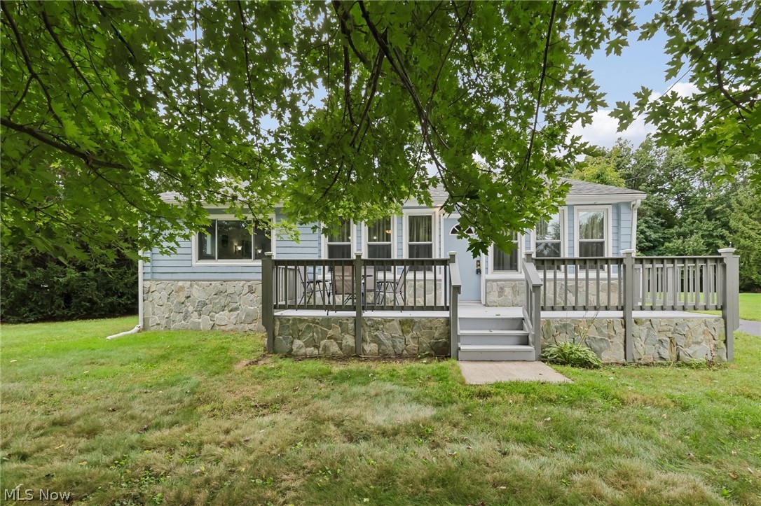 4188 Manchester Road Perry, OH 44081 - Photo 1 of 41 Light blue siding exterior with a stone-clad foundation