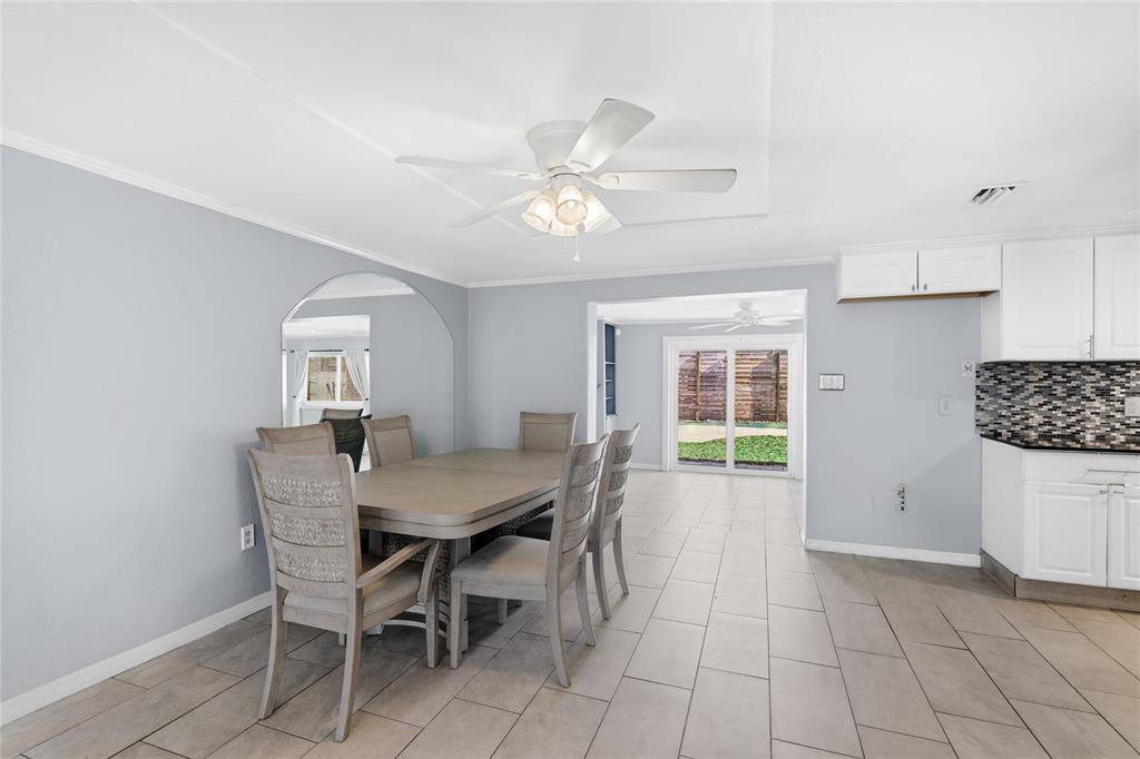 545 Bluebell Road Venice, FL 34293 - Photo 11 of 36 a view of a dining room with furniture and chandelier