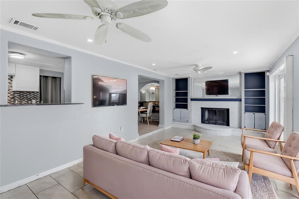 545 Bluebell Road Venice, FL 34293 - Photo 15 of 36 a living room with furniture and a fireplace
