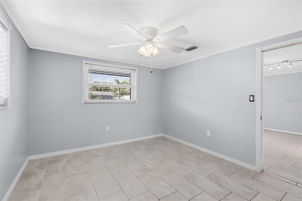 545 Bluebell Road Venice, FL 34293 - Photo 21 of 36 a view of an empty room with a window