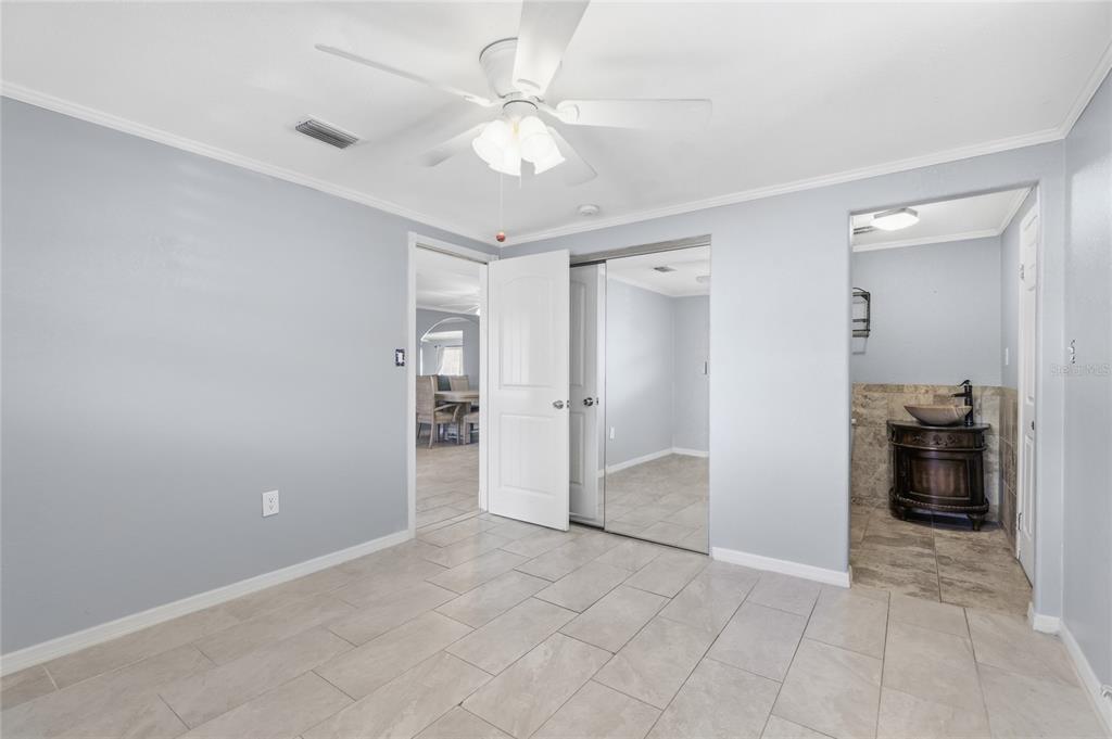 545 Bluebell Road Venice, FL 34293 - Photo 22 of 36 wooden floor in an empty room and a bathroom