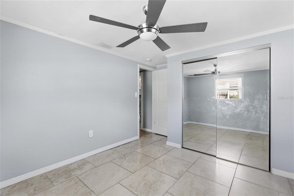 545 Bluebell Road Venice, FL 34293 - Photo 25 of 36 a view of an empty room and a fan