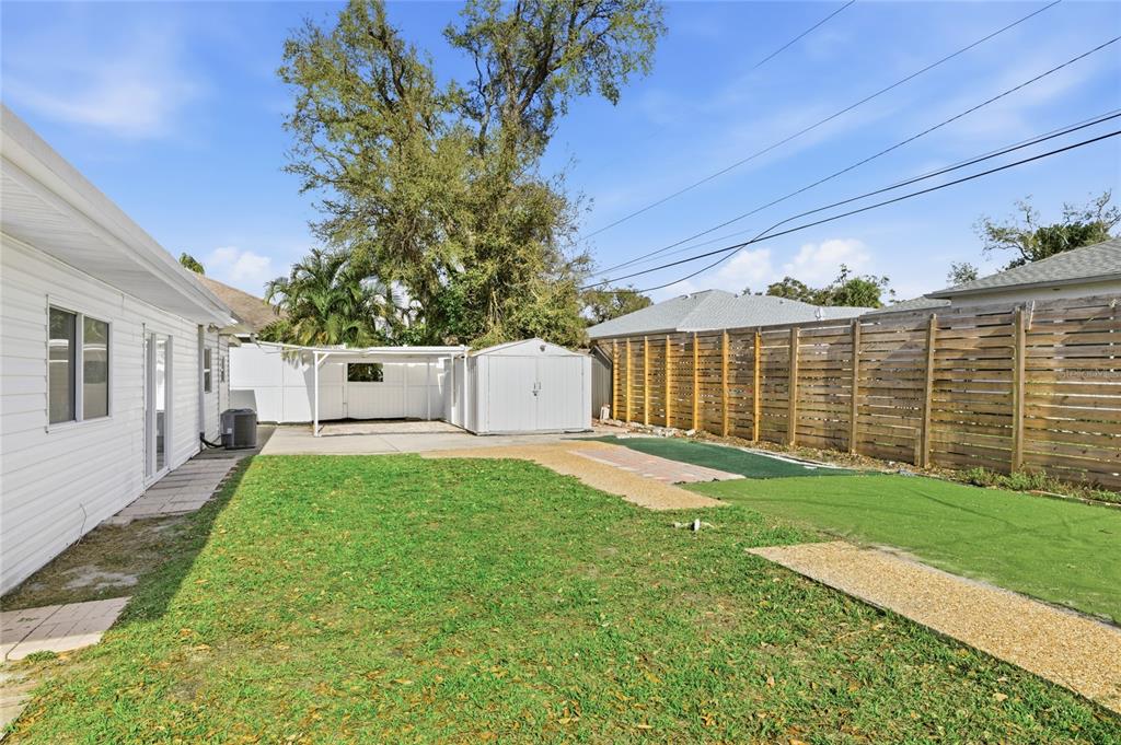 545 Bluebell Road Venice, FL 34293 - Photo 34 of 36 a view of backyard with a garden and trees