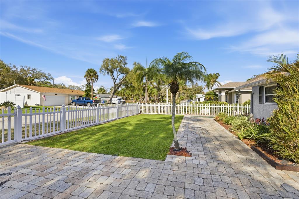 545 Bluebell Road Venice, FL 34293 - Photo 4 of 36 a view of a yard with palm trees