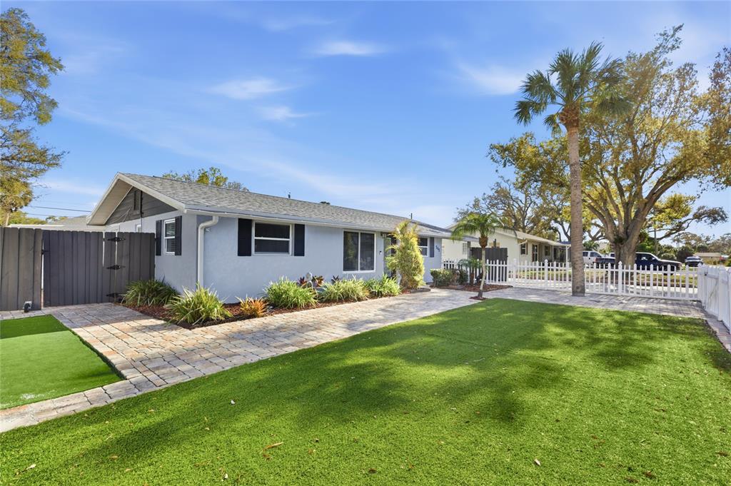 545 Bluebell Road Venice, FL 34293 - Photo 5 of 36 a view of a house with a big yard plants and large tree