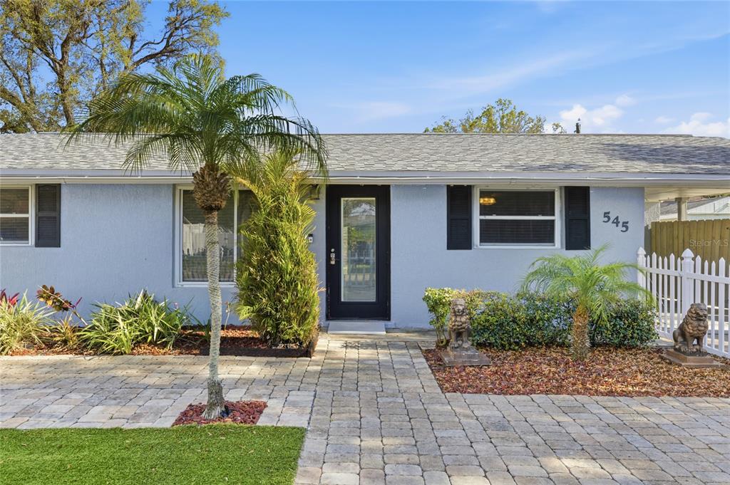 545 Bluebell Road Venice, FL 34293 - Photo 6 of 36 a front view of a house with a yard