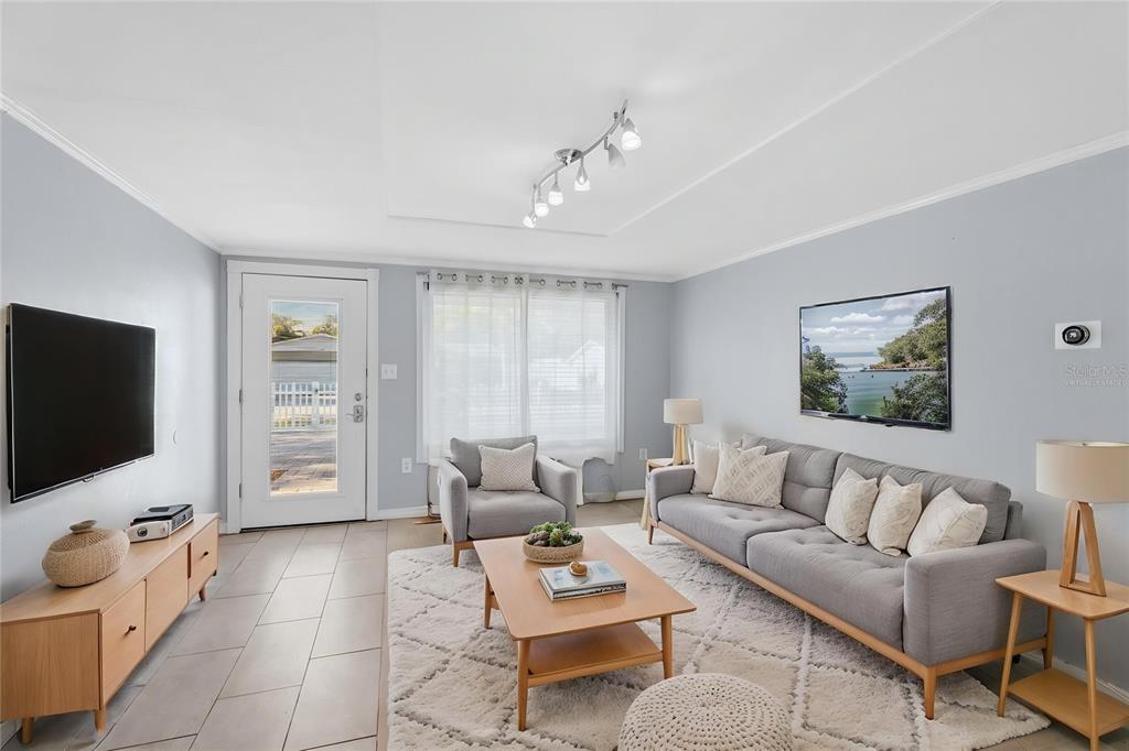 545 Bluebell Road Venice, FL 34293 - Photo 7 of 36 a living room with furniture and a flat screen tv