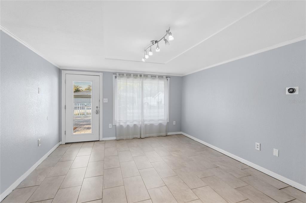 545 Bluebell Road Venice, FL 34293 - Photo 8 of 36 a view of an empty room with a window