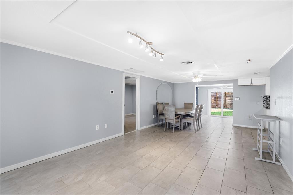 545 Bluebell Road Venice, FL 34293 - Photo 9 of 36 a view of dining room with furniture and a chandelier
