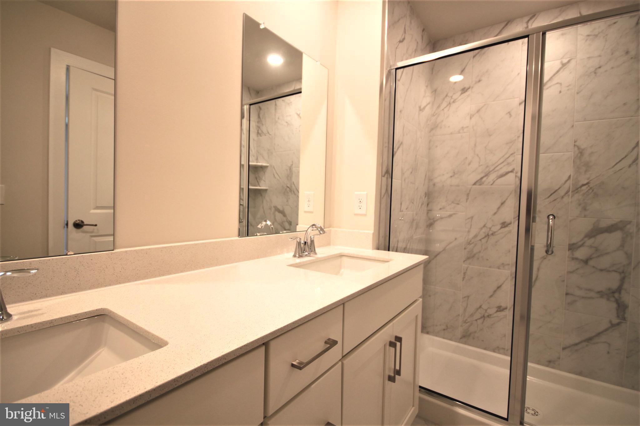 4856 Stump Road Pipersville, PA 18947 - Photo 19 of 35 a bathroom with a sink and a mirror