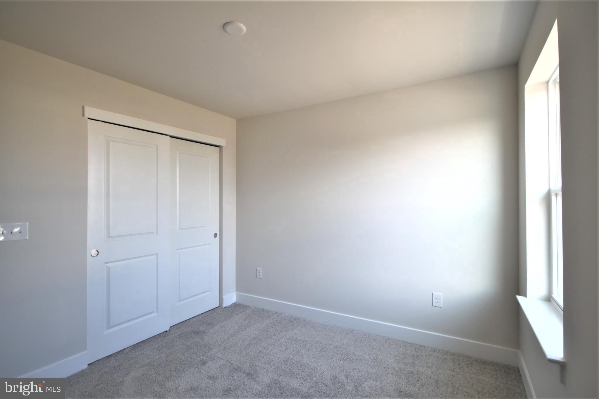 4856 Stump Road Pipersville, PA 18947 - Photo 23 of 35 an empty room with windows and closet