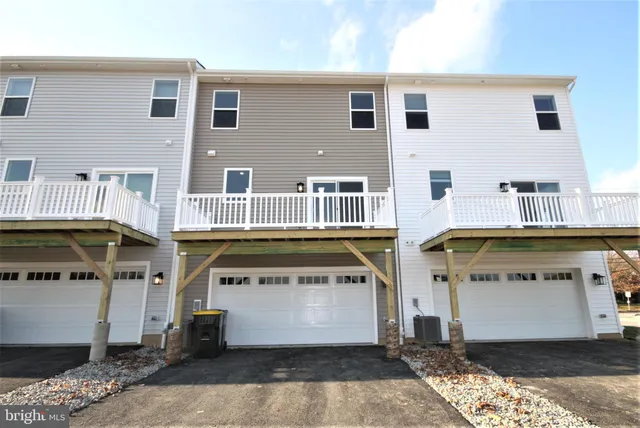 a view of a white building with many windows