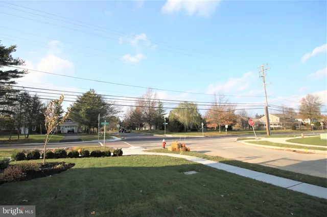 a view of a swimming pool and a yard