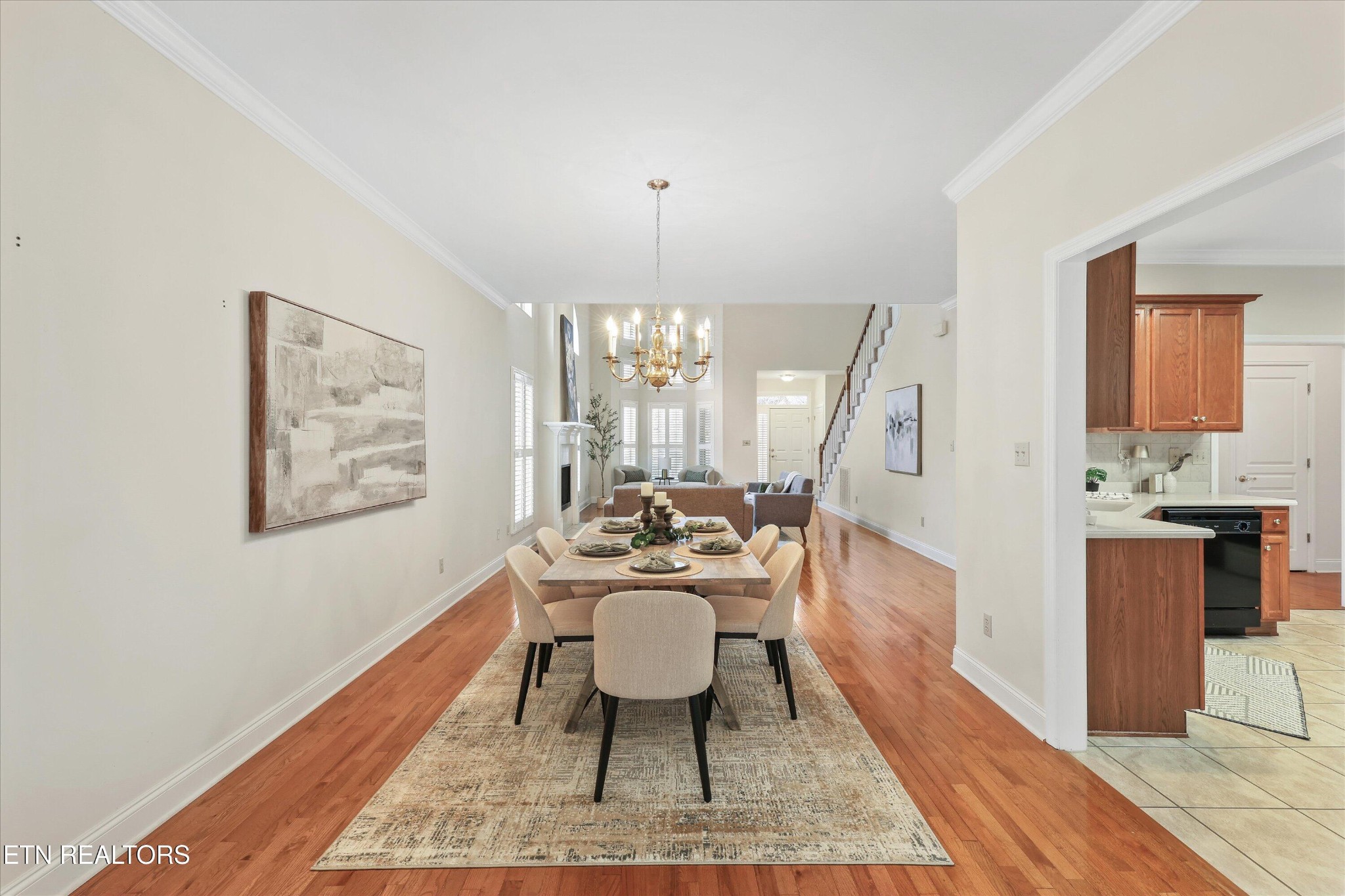 316 English Station Road Knoxville, TN 37934 - Photo 11 of 45 a dining room with wooden floor a chandelier a wooden table and chairs
