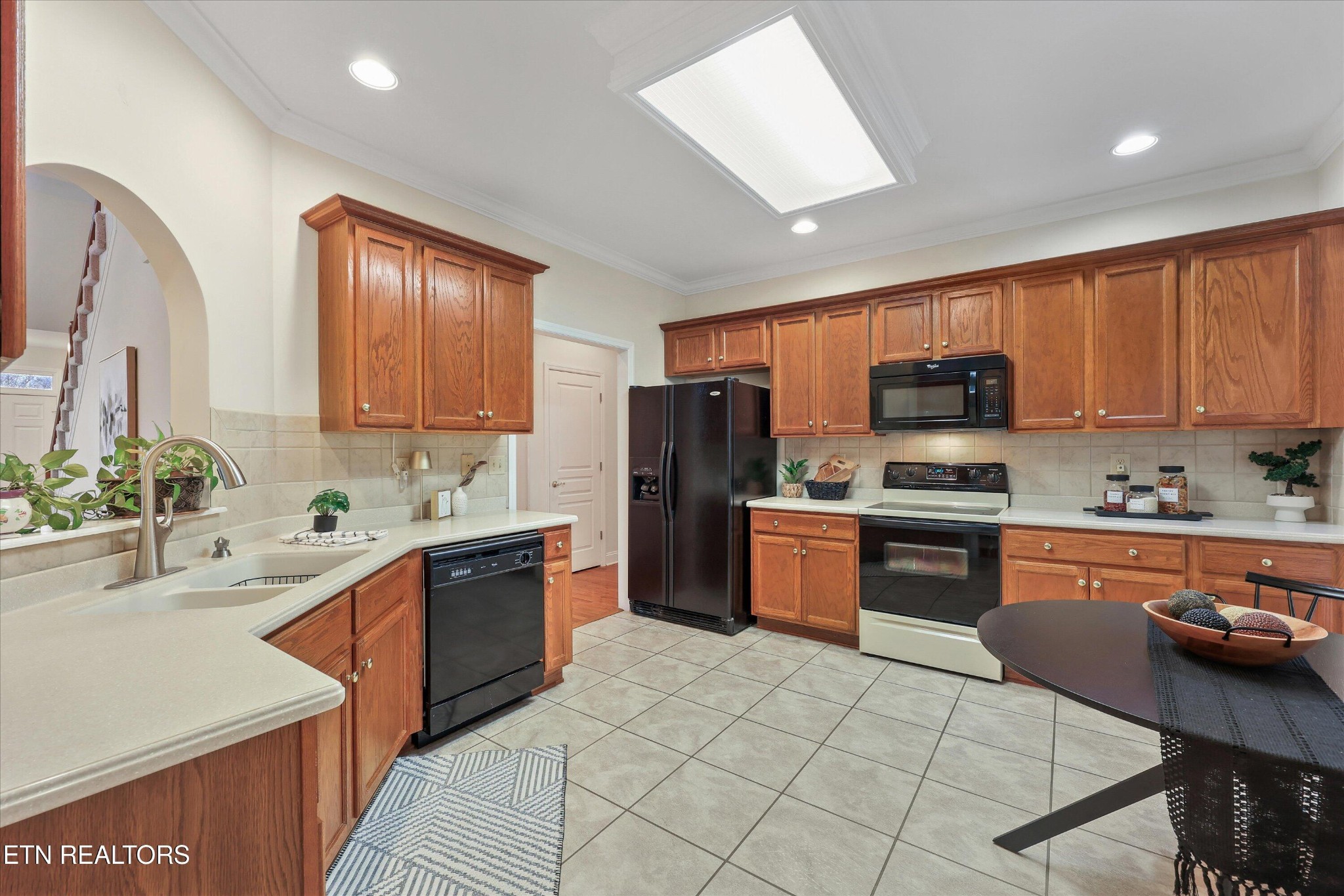 316 English Station Road Knoxville, TN 37934 - Photo 12 of 45 a kitchen with stainless steel appliances granite countertop a refrigerator stove microwave and sink
