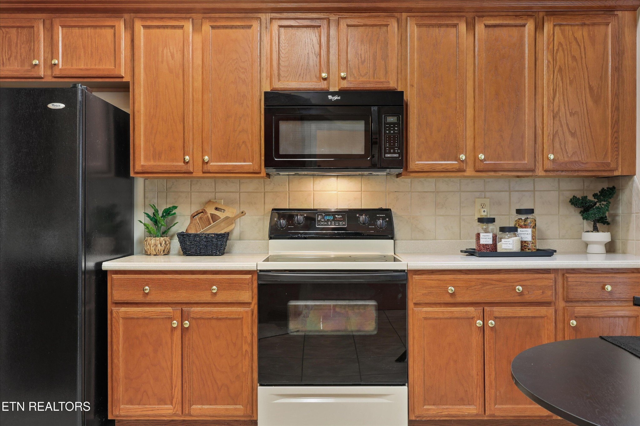 316 English Station Road Knoxville, TN 37934 - Photo 15 of 45 a kitchen with granite countertop a stove and a microwave